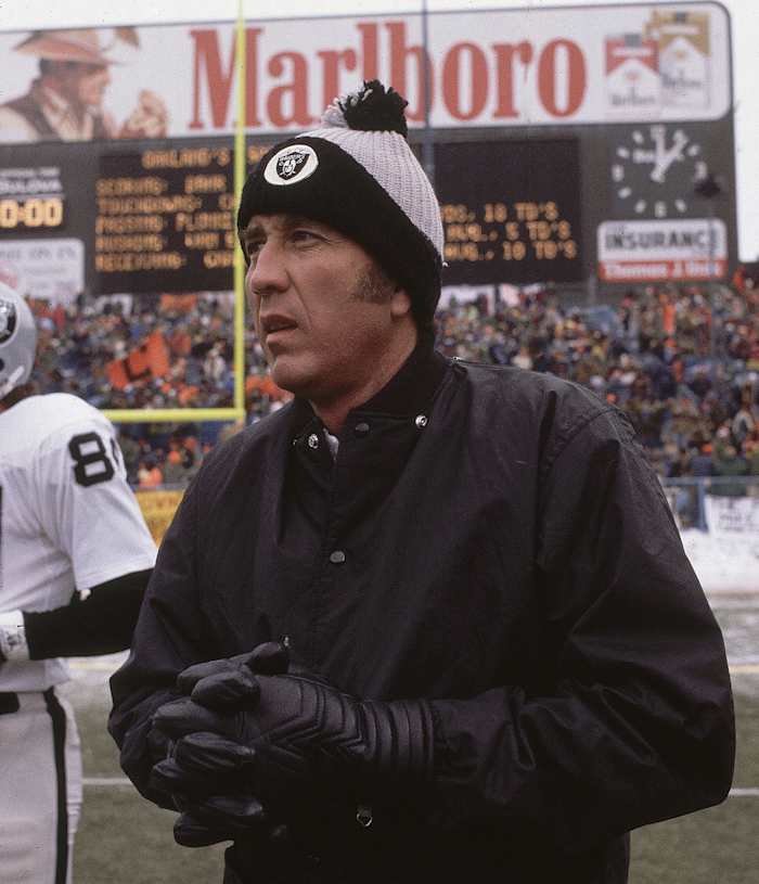 Tom Flores on the field before a playoff game in Cleveland after the 1980 season